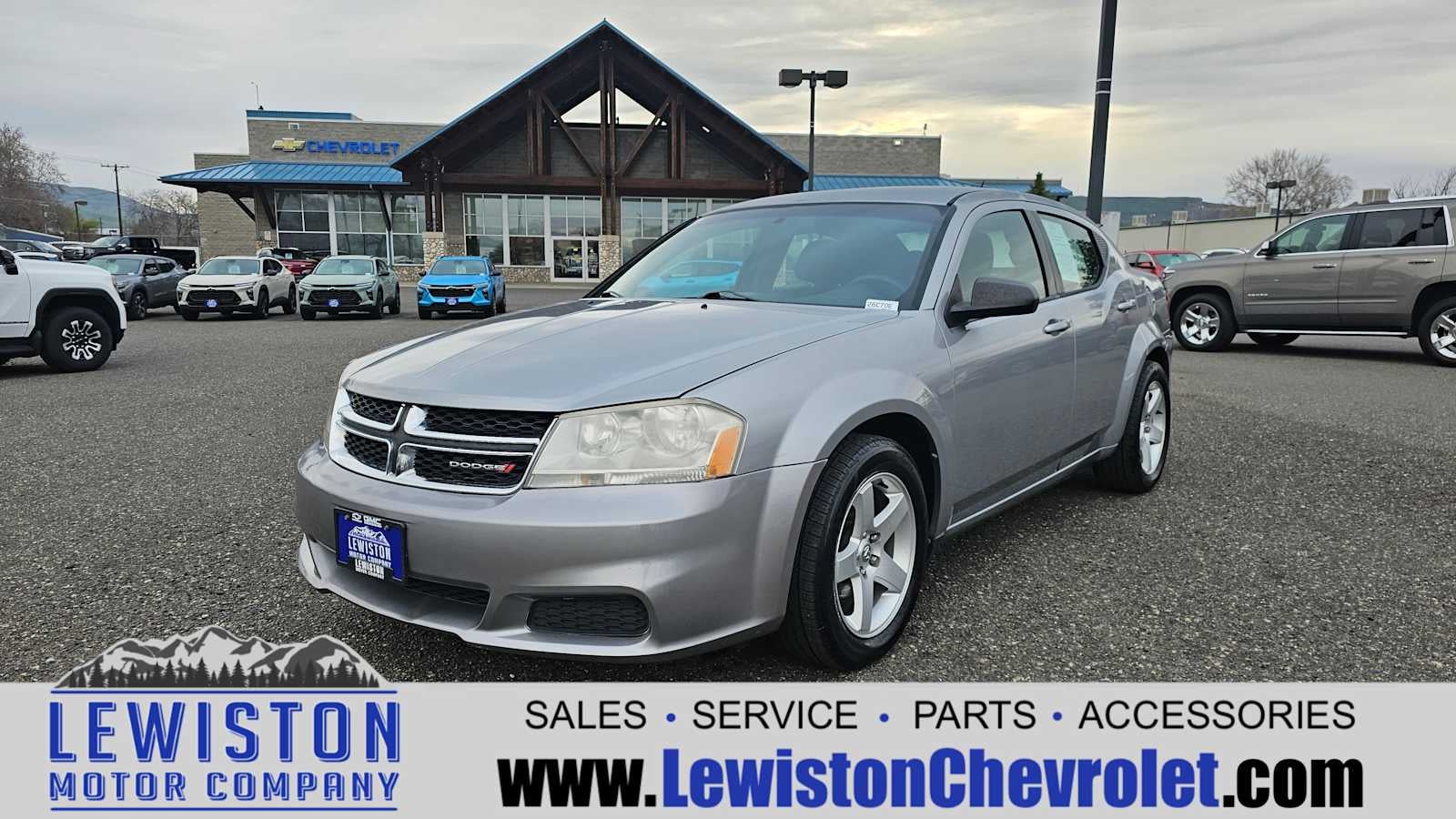 2013 Dodge Avenger SE in Silver — front three-quarter view
