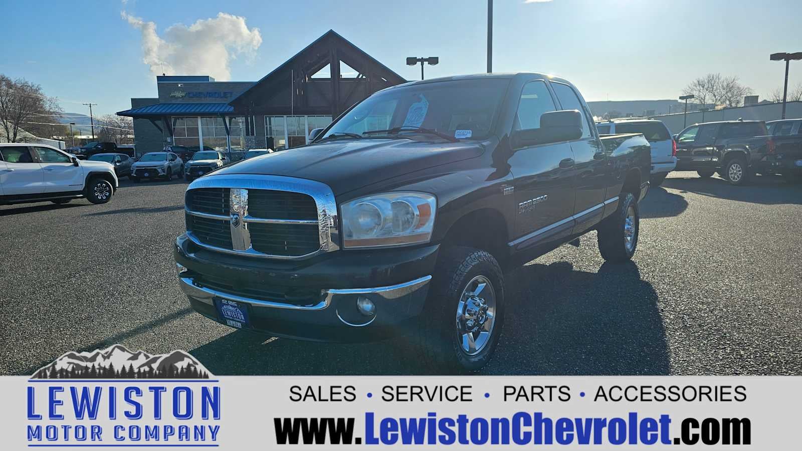 2006 Dodge Ram 2500 SLT in Black Clearcoat/Bright Silver Metallic Clearcoat — front three-quarter view