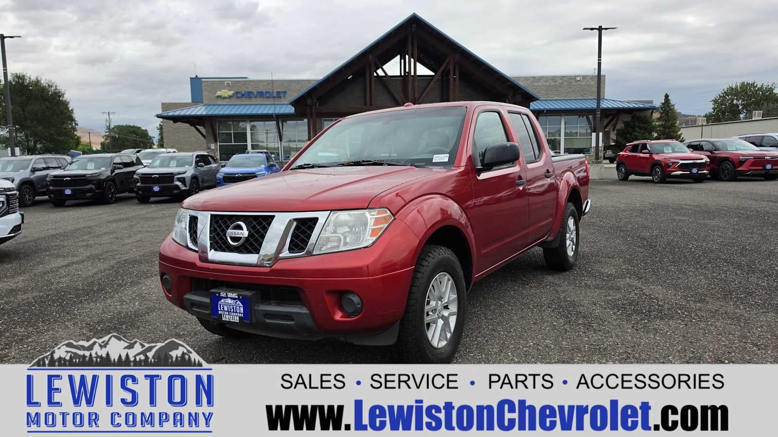 2016 Nissan Frontier SV in Red — front three-quarter view